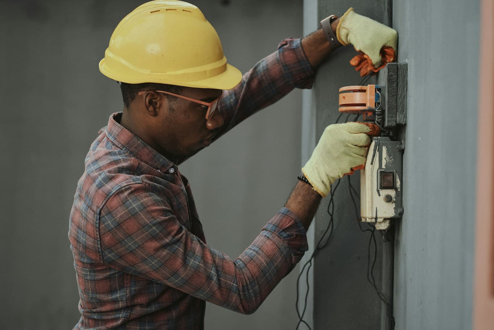 Technician servicing a residential air conditioner